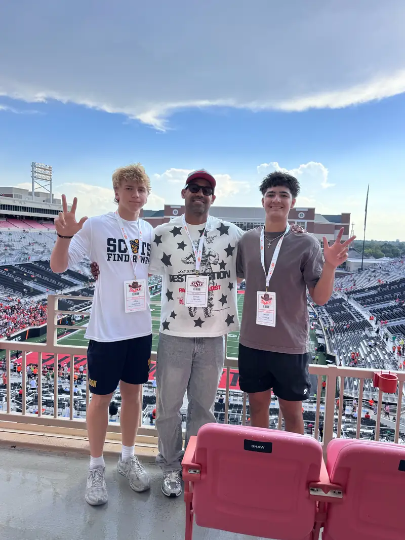 Craig LeBlanc with 2 Live clients Jaxon Franco and Hall Allison at Oklahoma State's football stadium